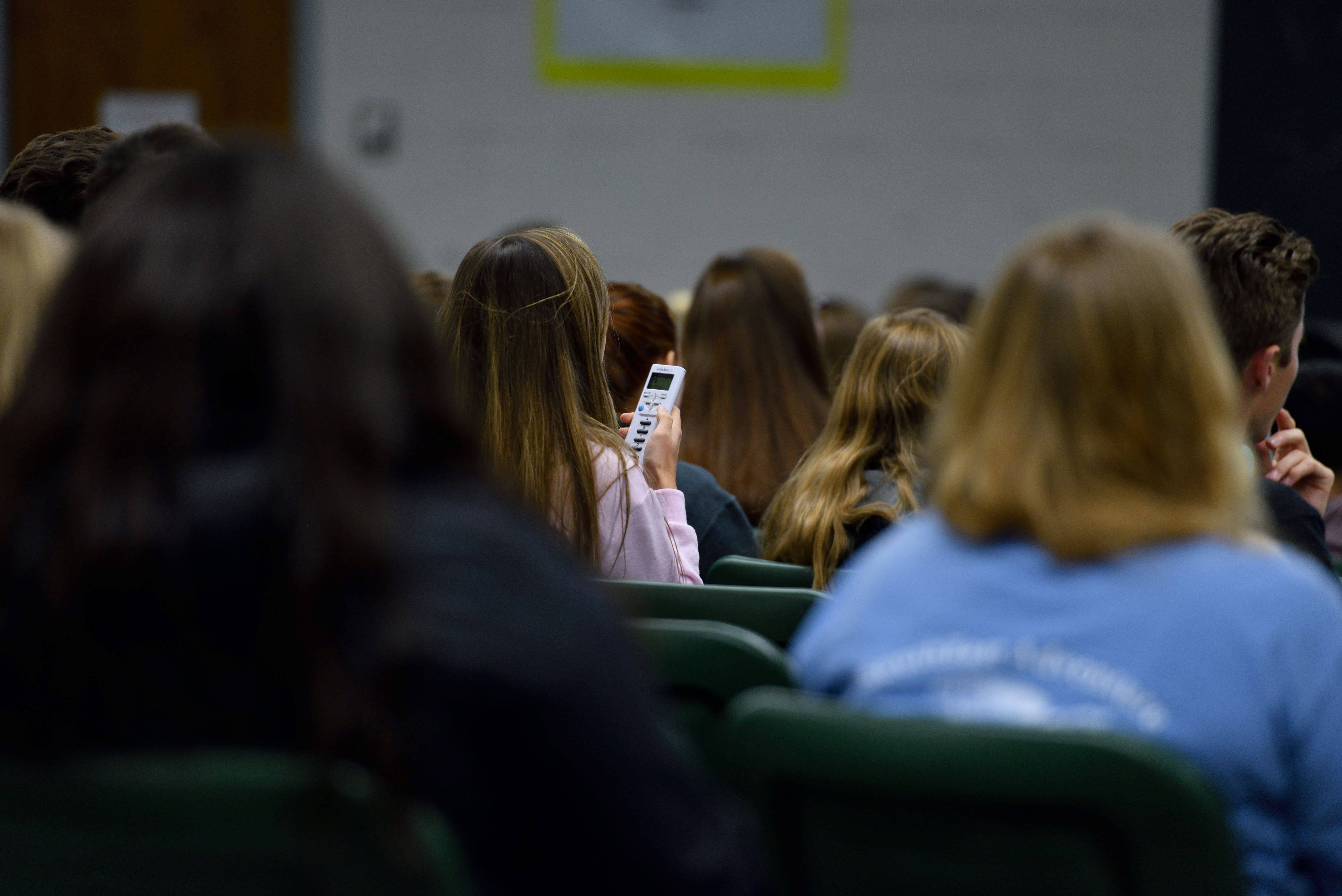 An MSU undergraduate answers a question in a campus lecture hall. Science education researchers will investigate the role of mathematics in undergraduate biology, chemistry, and physics courses, and how science curriculums might better incorporate mathematic knowledge. Credit: Harley Seeley.