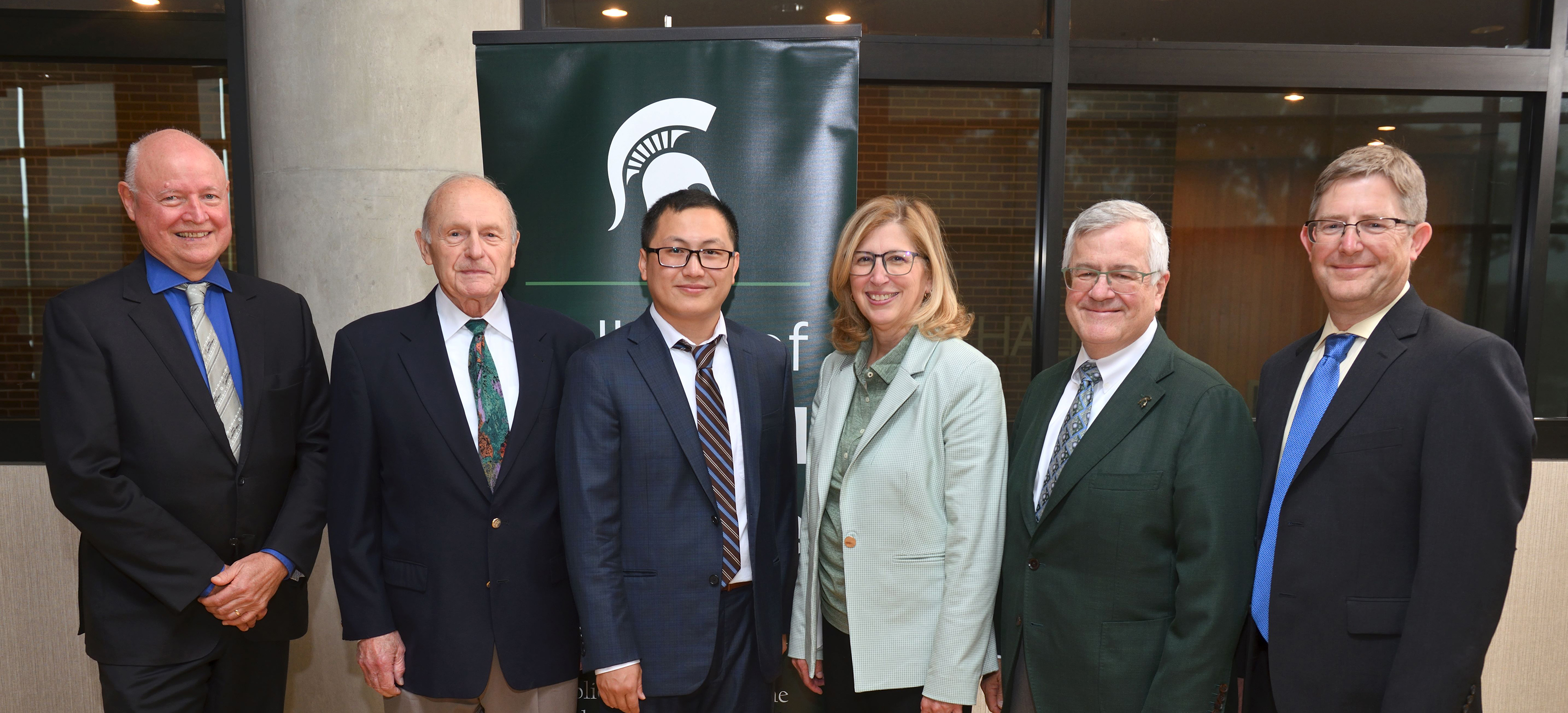 (L to R): Phil Duxbury, NatSci dean; Jim Hoeschele, donor, Carl H. Brubaker Endowed Professorship; Tuo Wang, Carl H. Brubaker, Jr. Endowed Professor; Teresa K. Woodruff, MSU interim president; Tom O’Halloran, University Foundation Professor of Chemistry; and Tim Warren, Barnett Rosenberg Professor and chair of the Department of Chemistry, pose for a group photo following Wang’s investiture ceremony to honor him as the inaugural Carl H. Brubaker, Jr. Endowed Professor. Credit: Harley J. Seeley