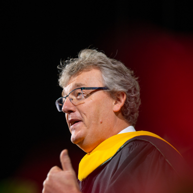 David MacMillan addresses graduates during fall commencement. During his speech, he encouraged the newest class of Spartans to learn from others, laugh every day, and learn from failure. He made special note of the hardships the class of 2023 overcame, and how these challenges prepared them more than ever to change the world. Photo credit: Michigan State University/Nick Schrader.