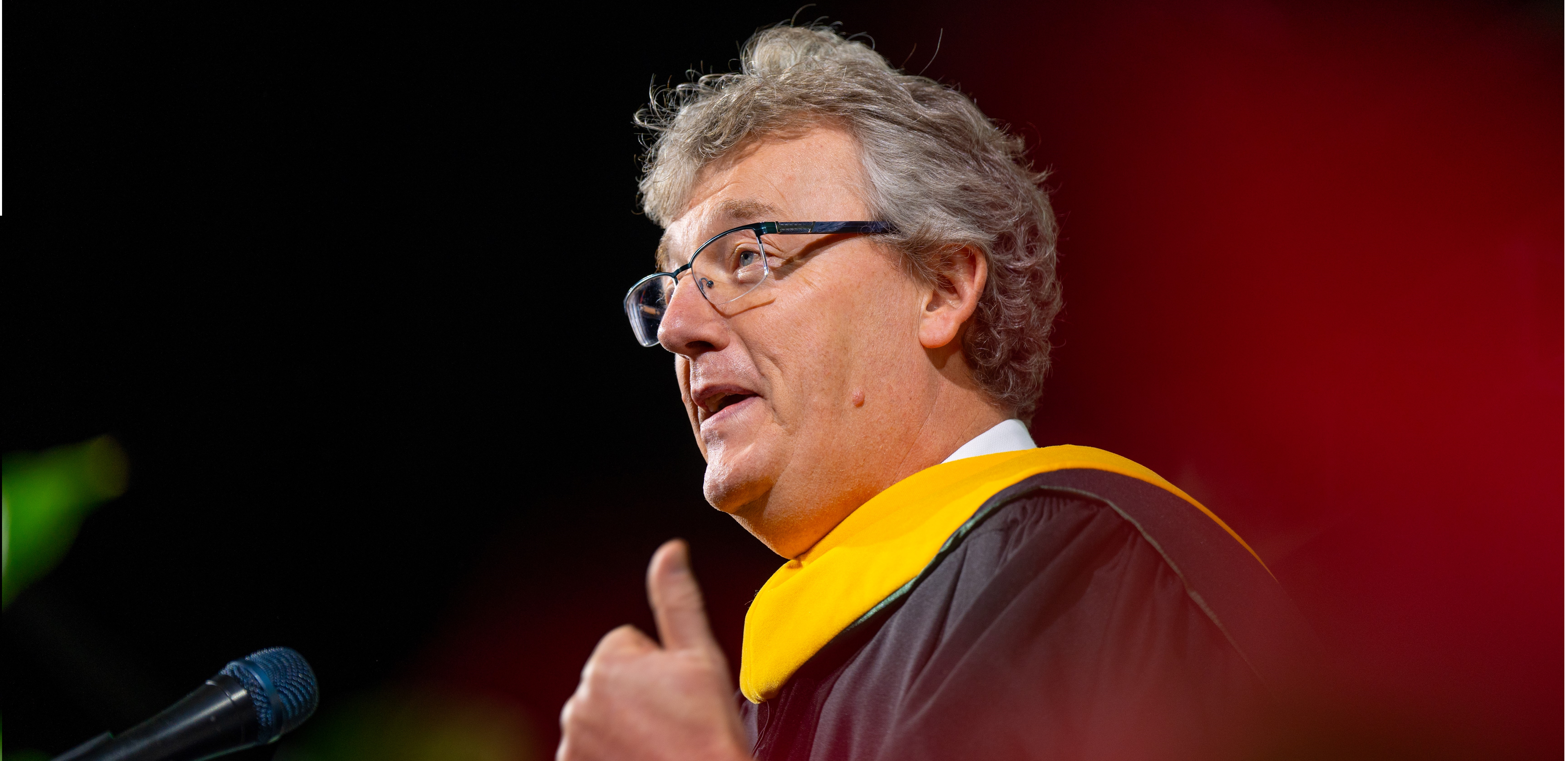 David MacMillan addresses graduates during fall commencement. During his speech, he encouraged the newest class of Spartans to learn from others, laugh every day, and learn from failure. He made special note of the hardships the class of 2023 overcame, and how these challenges prepared them more than ever to change the world. Photo credit: Michigan State University/Nick Schrader.