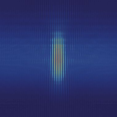 Close up of a glass cube on a laser instrumentation table.