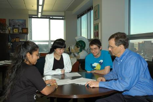 The Maleczka Group reviewing their research.