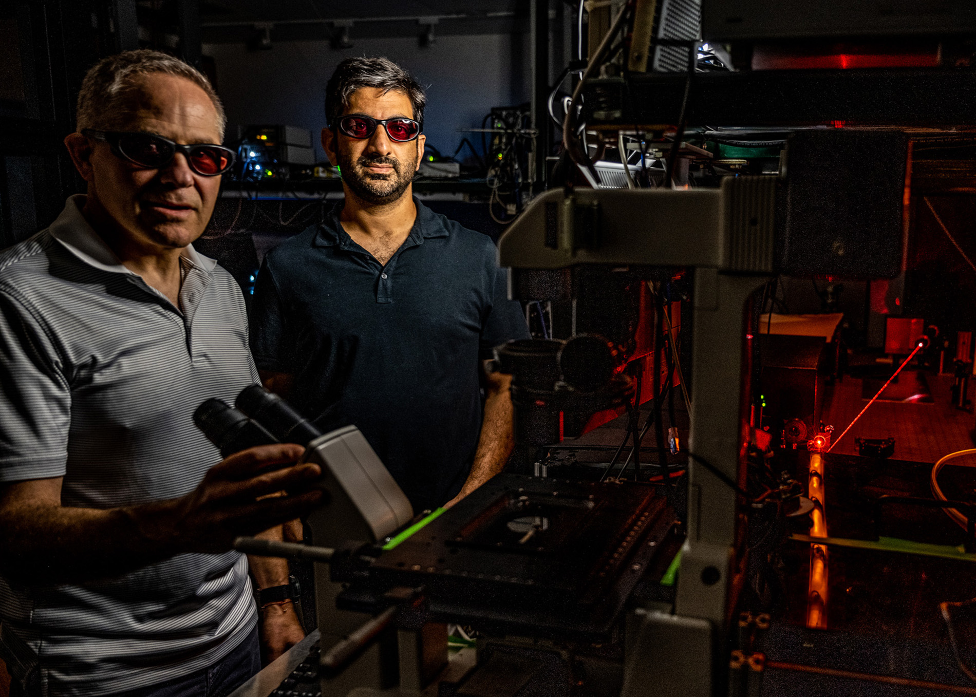 MSU researchers Marcos Dantus (left) and Elad Harel (right) are using ultrafast laser pulses to create a new type of microscope. Credit: Derrick L. Turner